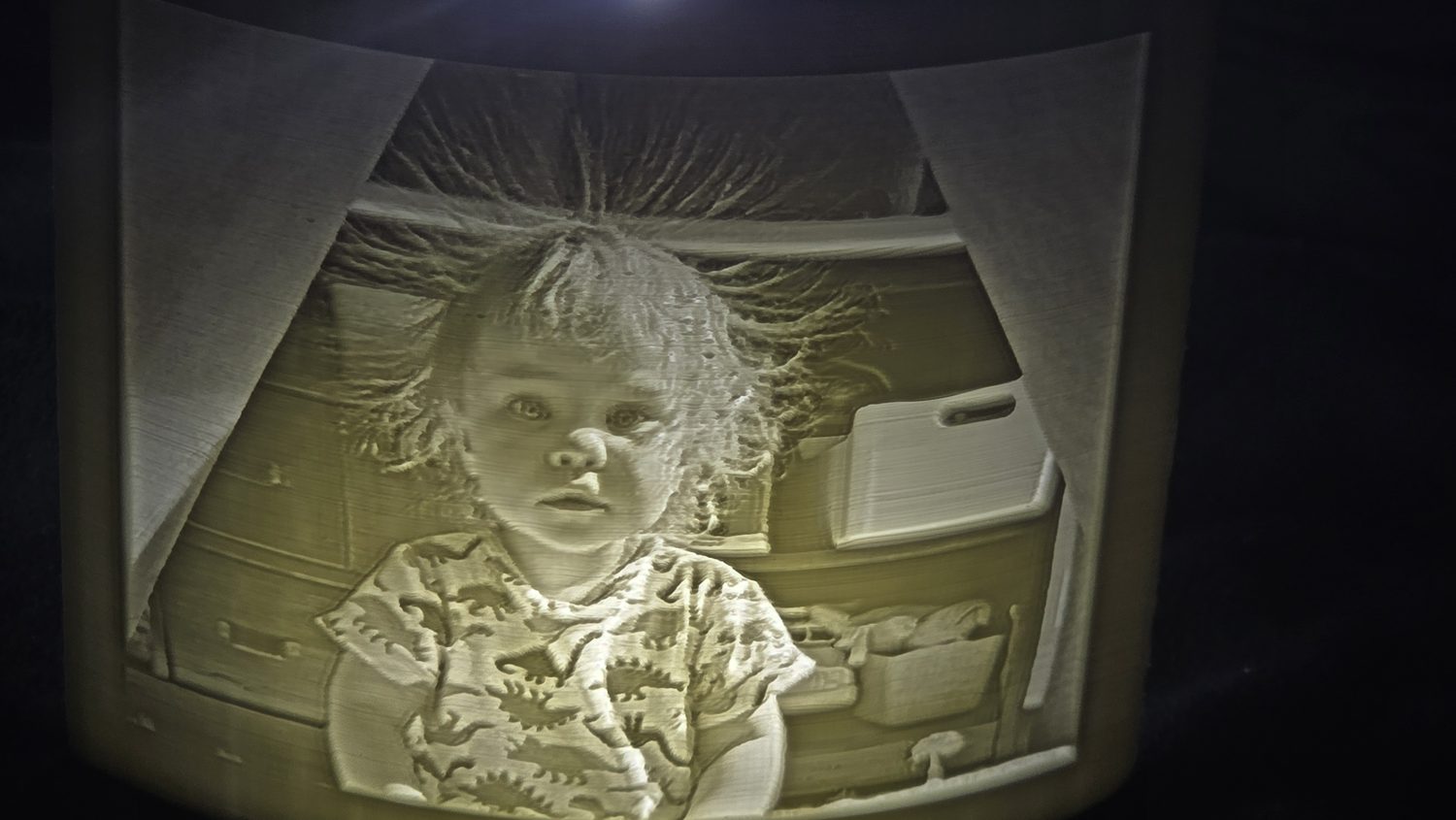 The same lithophane illuminated from behind