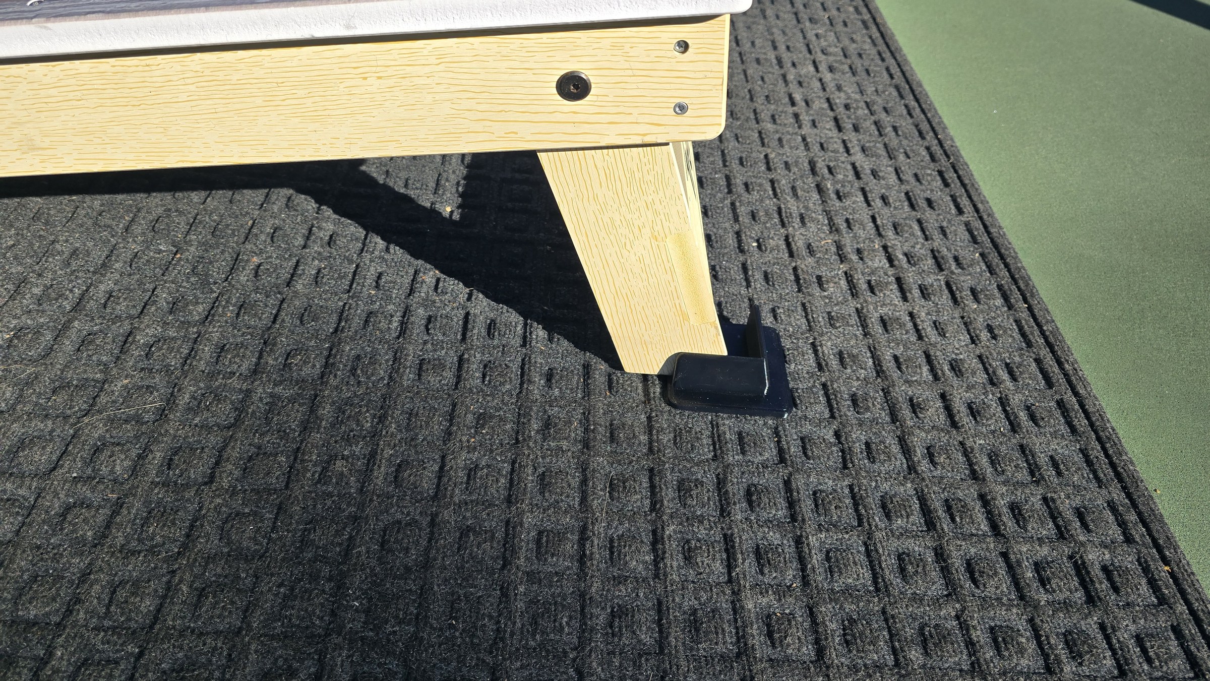 A printed foot fitted beneath a wooden leg.